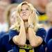 A Michigan fan shows her frustration as she looks up at the scoreboard during the second quarter of the Cowboy Classic at Cowboy Stadium in Arlington, Texas on Saturday. Melanie Maxwell I AnnArbor.com